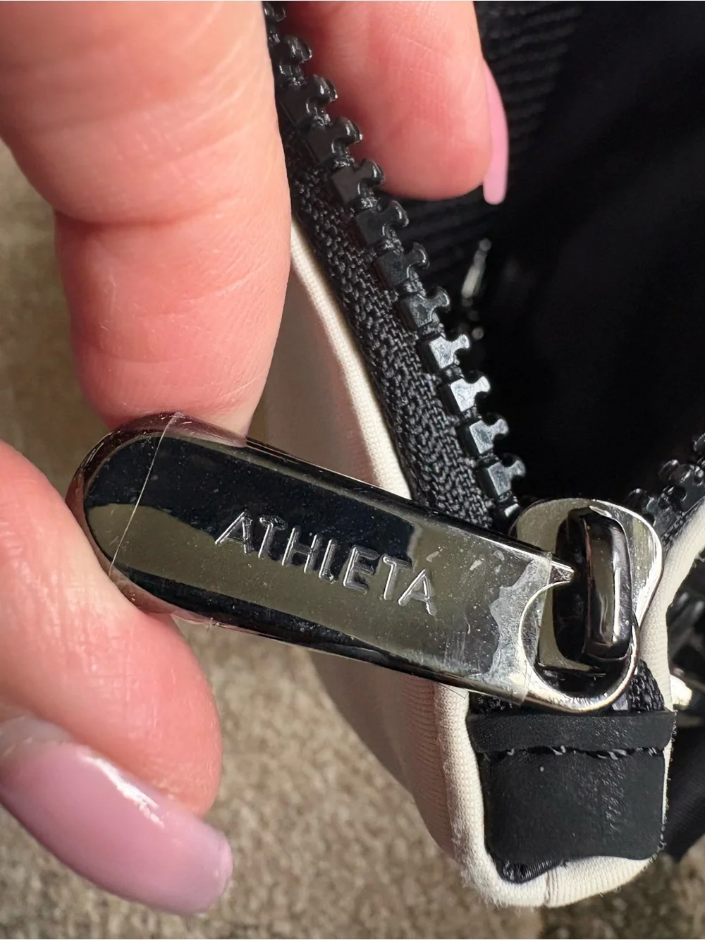 white and black Caraa x Athleta crossbody bag